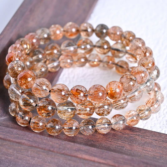 Natural Black Gold Super Seven beaded bracelet with unique mineral inclusions for spiritual protection