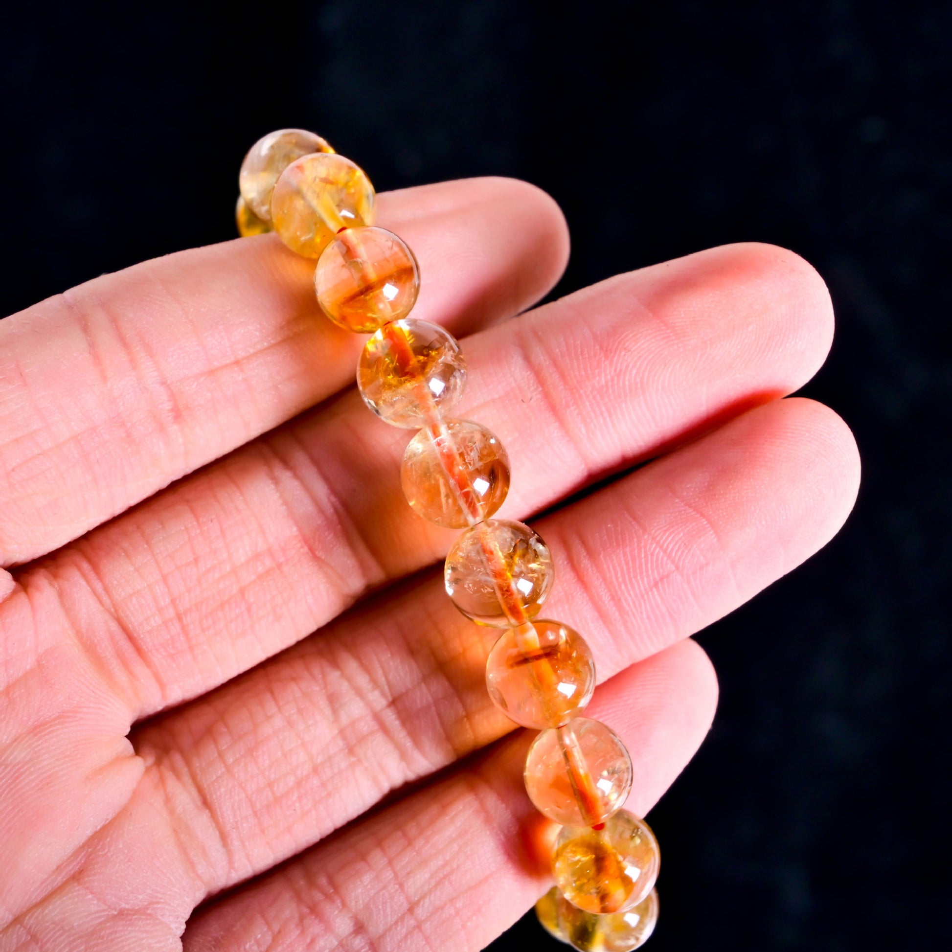 Natural citrine bracelet worn on hand, yellow crystal stretch bracelet for spiritual and Feng Shui purposes