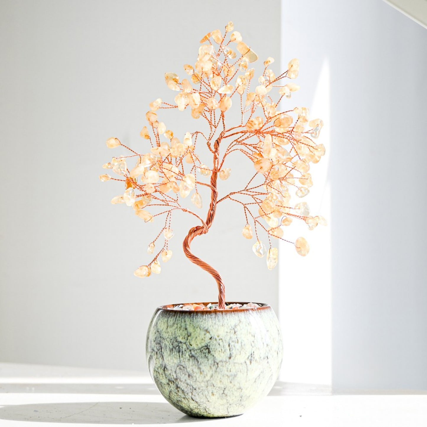 Citrine Feng Shui crystal money tree in a tall decorative vase, surrounded by shimmering gemstone chips, symbolizing abundance, joy, and strong wealth chi flow