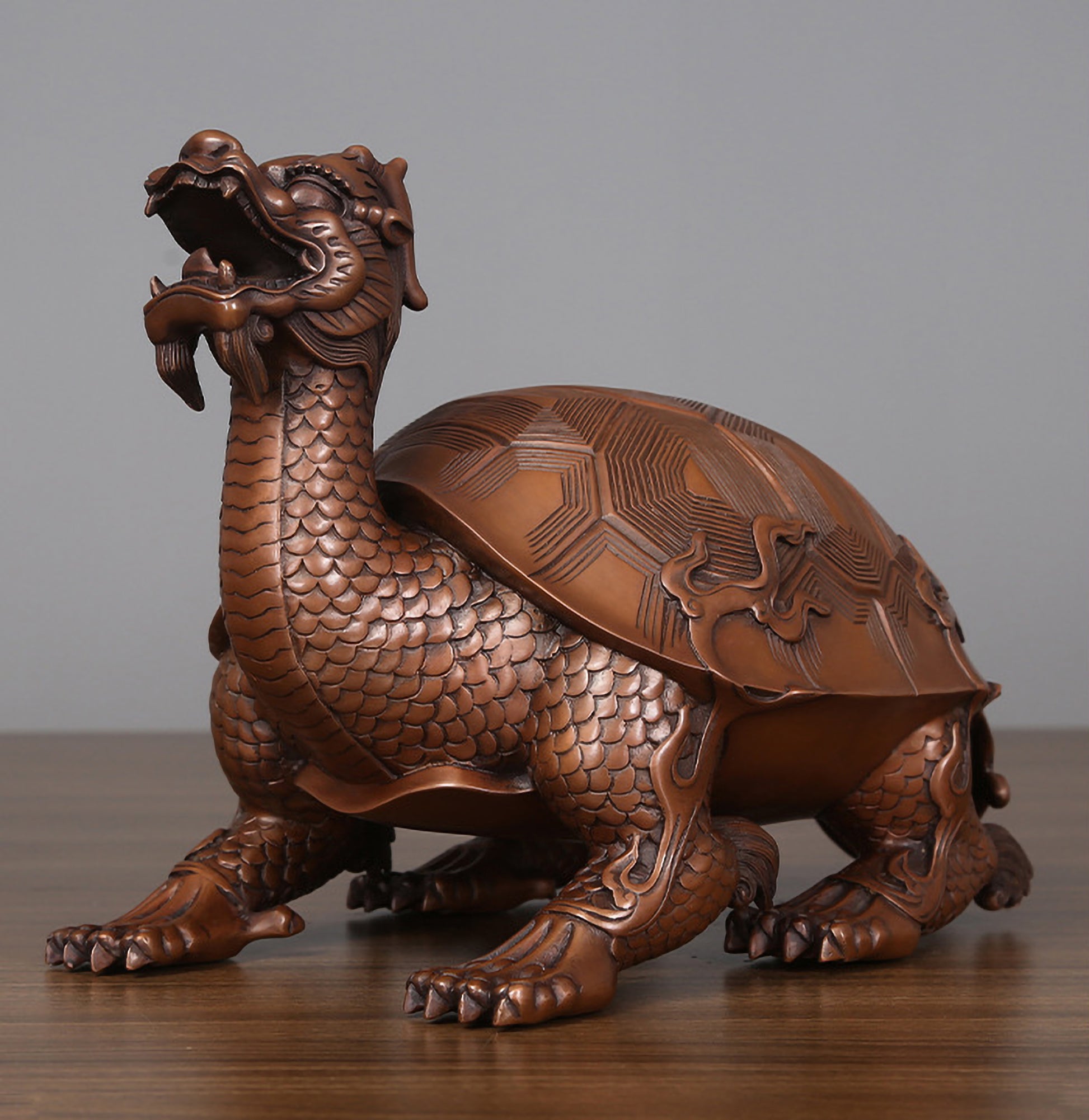 Medium hollow bronze dragon turtle viewed from front left at a 45-degree angle