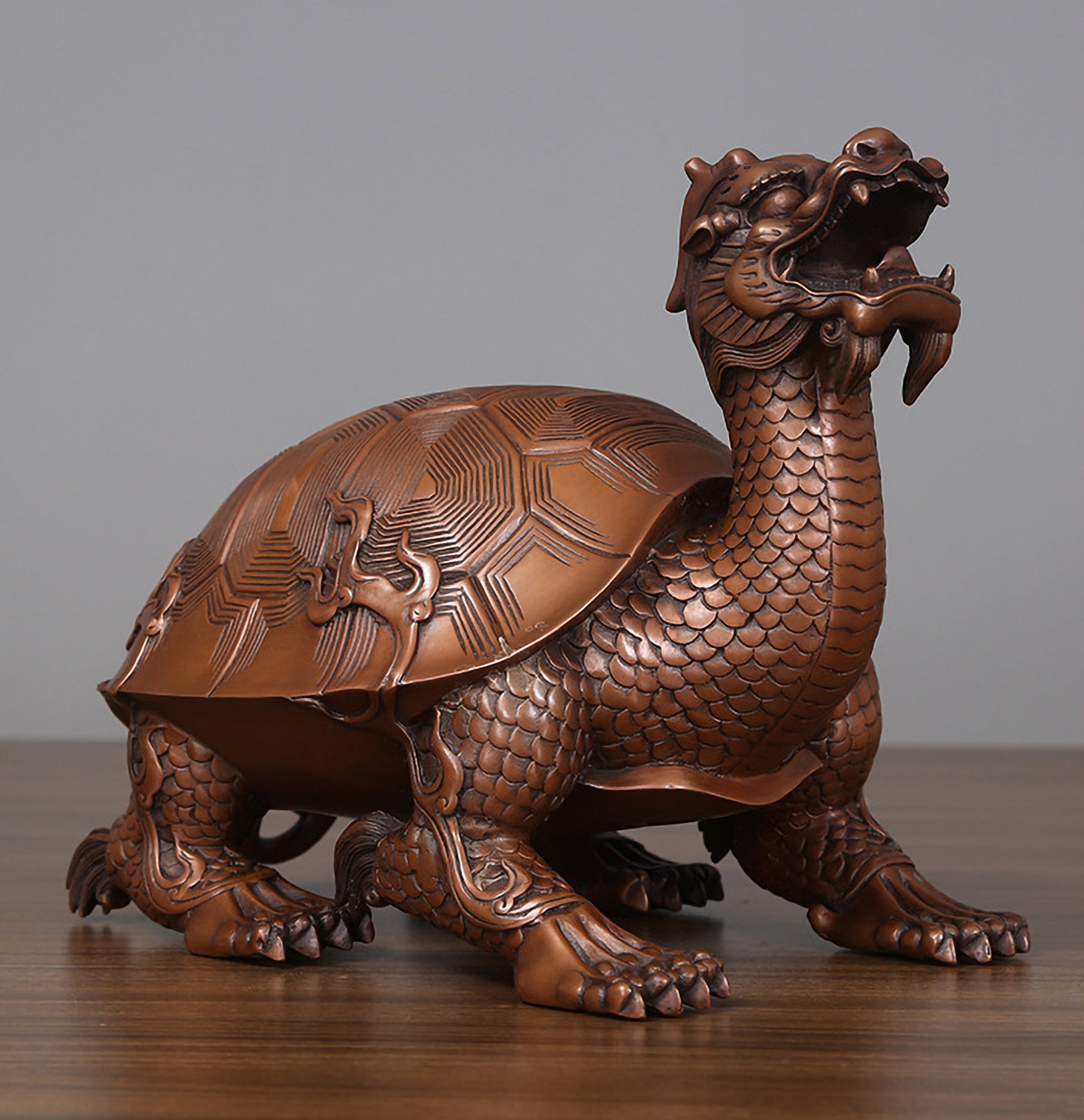 Medium hollow bronze dragon turtle viewed from front right at a 45-degree angle