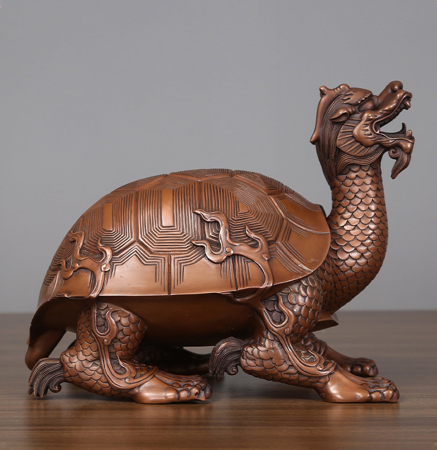 Side profile view of a medium hollow bronze dragon turtle showing full posture