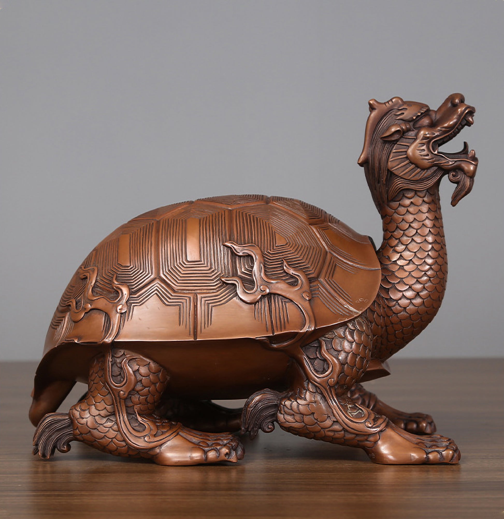 Side profile view of a medium hollow bronze dragon turtle showing full posture