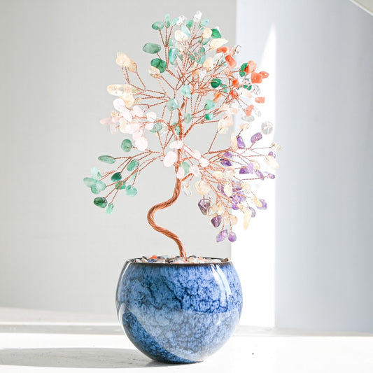 Multicolor Feng Shui crystal money tree with rainbow gemstones on copper branches, displayed in a tall pot with polished agate stones for chakra balance, vibrant energy, and home prosperity