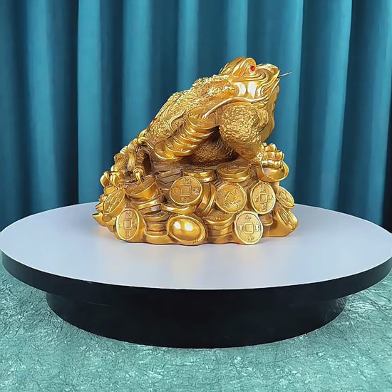 360-degree rotating video of a large hollow brass Feng Shui three-legged toad figurine with coin details, symbolizing wealth and prosperity
