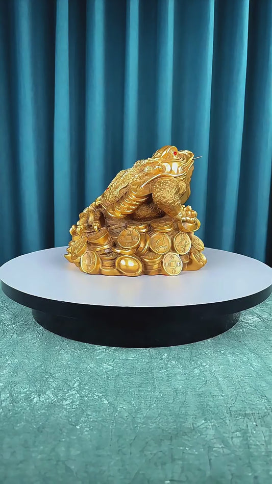 360-degree rotating video of a large hollow brass Feng Shui three-legged toad figurine with coin details, symbolizing wealth and prosperity